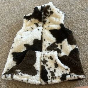 Cow print fuzzy vest.
